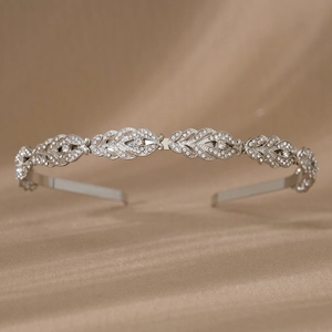 Macro detail of silver wheat ear headband with sparkling rhinestones for bridal hairstyle
