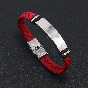 Detail of red braided leather bracelet with polished silver metal bar and buckle