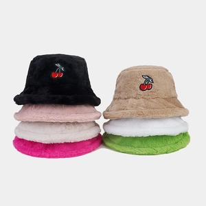 Detail of plush bucket hats with cherry embroidery in various colors for winter