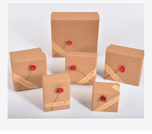 Brown kraft paper jewelry boxes with red paper roses and Just for you ribbon detail