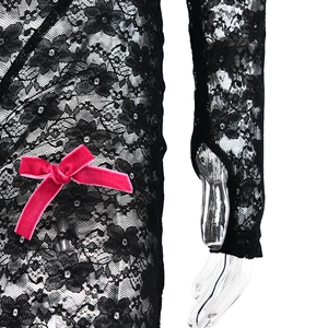 Close-up of black lace bodysuit featuring a contrast pink velvet bow detail