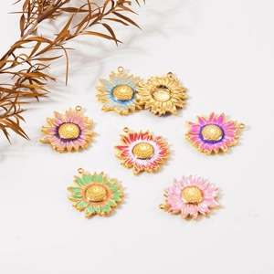 Detailed macro view of colorful enamel sunflower pendants with gold metal base