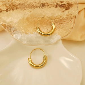Classic 18K gold-plated stainless steel chunky hoop earrings on a luxury silk background