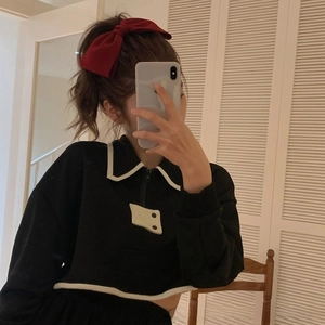 Chic oversized burgundy bow clip styled with a black and white zip-up collar sweatshirt