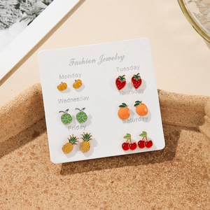 Set of 6 pairs of colorful fruit enamel stud earrings on a weekly fashion jewelry card
