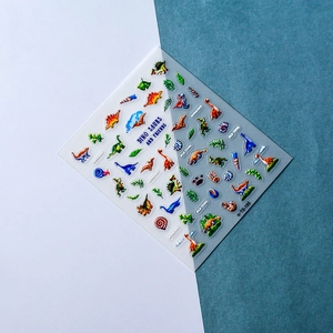 Macro detail of 5D embossed dinosaur nail stickers with textured prehistoric patterns