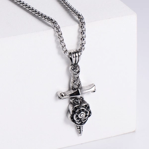 Macro shot of vintage sword-wrapped rose pendant in antique silver stainless steel