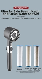 Detail of high-pressure shower head with massage nodes and triple water filter stages