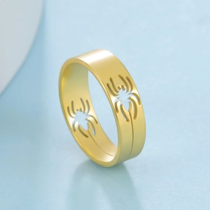 Golden stainless steel spider web hollow ring for men and women shown from 45-degree angle