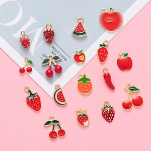 Assorted DIY colorful enamel fruit pendants in red and gold for jewelry making