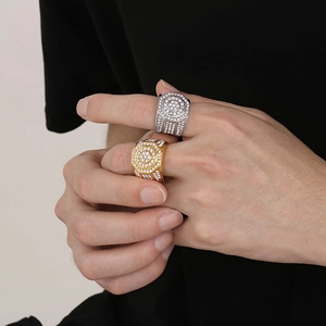 Close-up of hip-hop octagon rings with handset pave zircon in gold and silver finish