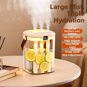 Close-up of triple-nozzle mist output and LED display on minimalist desktop humidifier