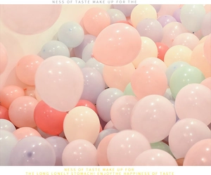 Close-up of colorful macaron latex balloons in soft pink, blue, and purple for party decor