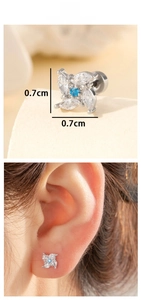 Macro view of windmill zircon stud earring showing 0.7cm diameter and ear-worn effect