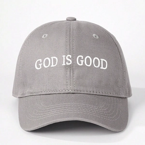 Detail of grey cotton baseball cap featuring high-quality white God Is Good embroidery