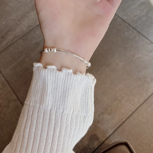 Minimalist 925 sterling silver beaded bracelet with baroque pearls worn on wrist