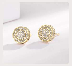 Macro shot of gold-plated hip hop stud earrings with pave-set cubic zirconia stones