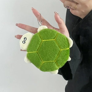 Detail of plush turtle coin purse with green shell and silver metal bead chain