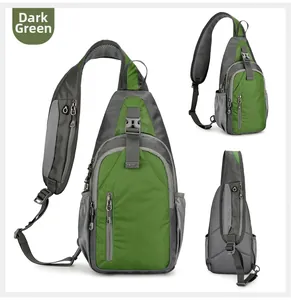 Detail view of dark green waterproof sling bag with multiple compartments and mesh pocket