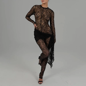 Close-up of sheer floral lace fabric and sleeve detail on a black sexy mesh catsuit