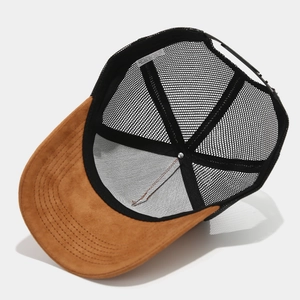 Detail view of the breathable mesh back and inner 100% polyester label on a trucker hat