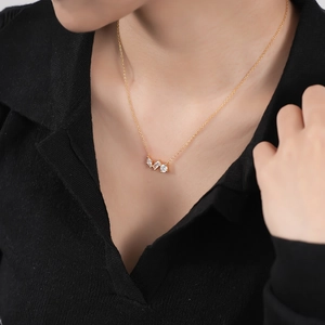 Elegant 925 sterling silver gold necklace featuring pear, rectangle, and round zircons