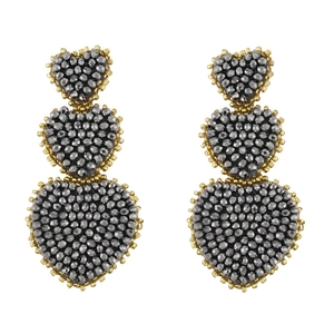 Detail of bohemian triple heart drop earrings with grey beads and golden trim embroidery