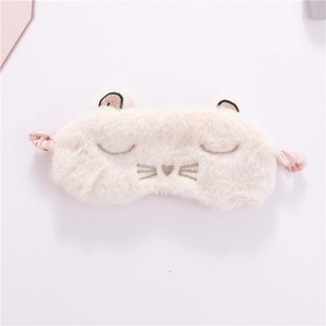 Detail of pink plush cat eye mask showing soft texture and eyelash embroidery