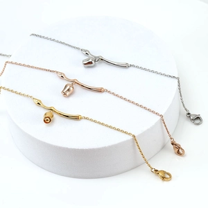 Minimalist 18K rose flower bracelets in gold, rose gold and silver on white display