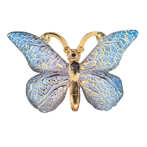 Detailed macro view of a golden gradient resin butterfly pendant for jewelry making