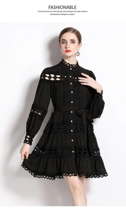 Close-up of lace collar and pearl button details on a black palace style dress