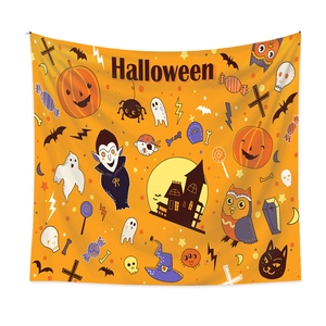 Detail of Halloween tapestry featuring pumpkin, ghost and castle on orange background
