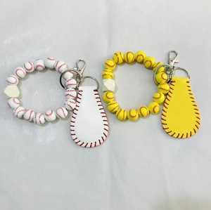 Detail of beaded baseball and softball keychains with silicone beads and leather pendants