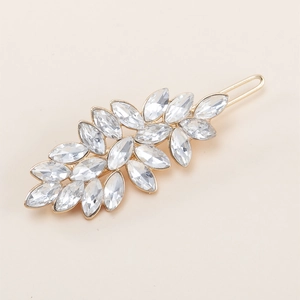 Exquisite golden metal leaf hair clip set with sparkling marquise rhinestones on beige