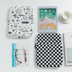 Detail view of checkerboard and space print iPad sleeves with top zipper and front pocket