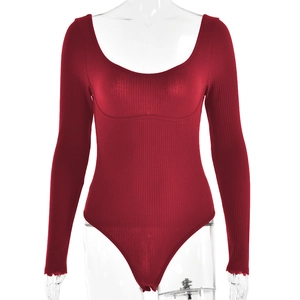 Detail of red ribbed long-sleeve bodysuit featuring a wide U-neckline and slim fit