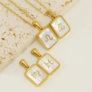 Gold plated zodiac necklace with rectangle white shell pendants and cutout constellation signs