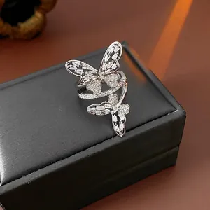 Hollow butterfly open ring with sparkling cubic zirconia on a black jewelry display box