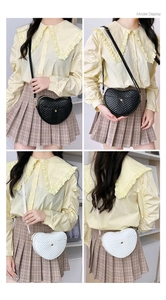 Detailed model display of quilted heart-shaped crossbody bag with V-stitch and gold buckle