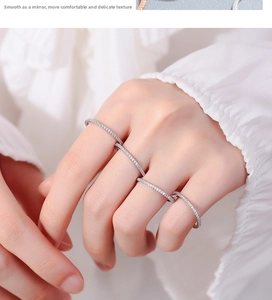 Close-up of four minimalist 925 sterling silver eternity rings with cubic zirconia inlay