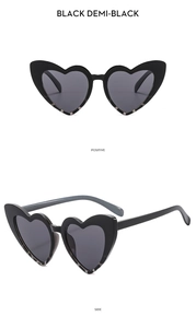 Front and side views of black demi-black heart sunglasses with glitter details