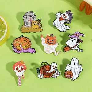 Detail view of eight cartoon Halloween enamel pins with ghosts, pumpkins, and black cats