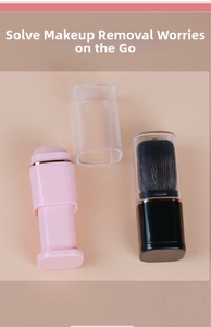 Portable retractable makeup brush with pink bristles and a clear dustproof cap cover