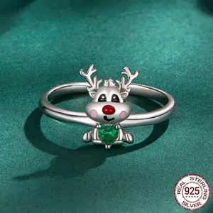 925 silver reindeer ring with green heart gemstone and red nose detail on green background
