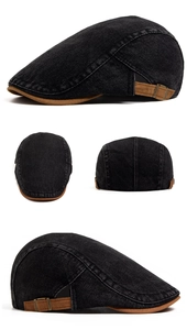 Detail of vintage washed denim newsboy cap with brown suede brim and adjustable metal buckle