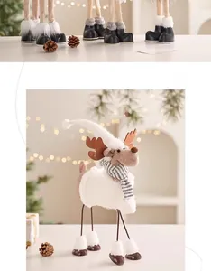 Detail of warm white plush reindeer with felt antlers and a striped knitted scarf