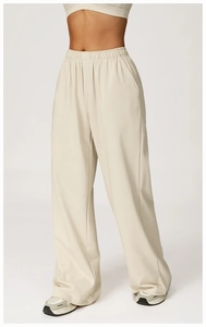 Detail view of high waist wide-leg joggers featuring elastic waistband and side pockets