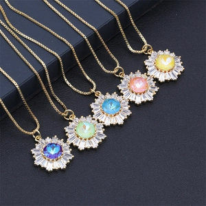 Macro shot of five sunflower necklaces with colorful cubic zirconia in gold finish