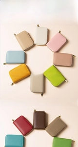 Detailed close-up of colorful RFID blocking card wallets in premium lychee grain leather
