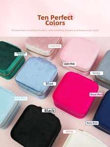 Multiple colors of velvet jewelry boxes displayed on a soft plush background